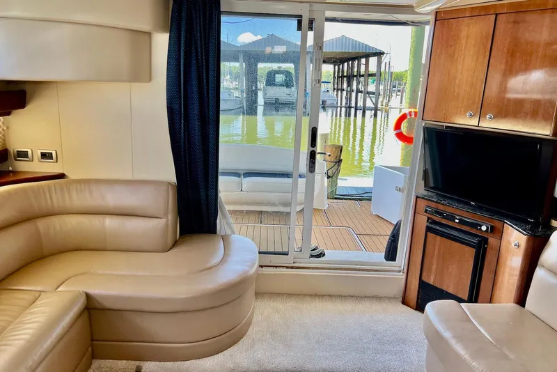 Slide: The Image of Interior of 2008 Meridian 391 Sedan yacht with leather seating and marina view. - 18