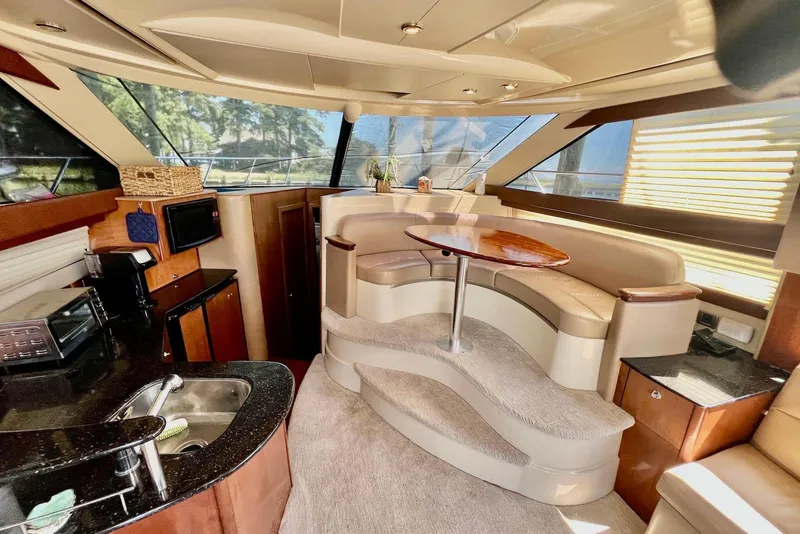 Slide: The Image of Luxurious interior of 2008 Meridian 391 Sedan yacht with elegant seating and modern amenities. - 19