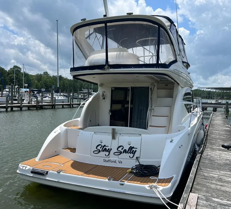 Slide: The Image of 2008 Meridian 391 Sedan yacht docked, named "Stay Salty," in Stafford, Virginia marina. - 2