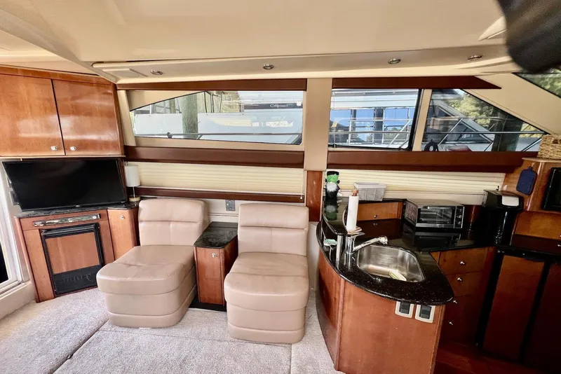 Slide: The Image of Luxurious interior of 2008 Meridian 391 Sedan yacht with plush seating and modern kitchenette. - 21