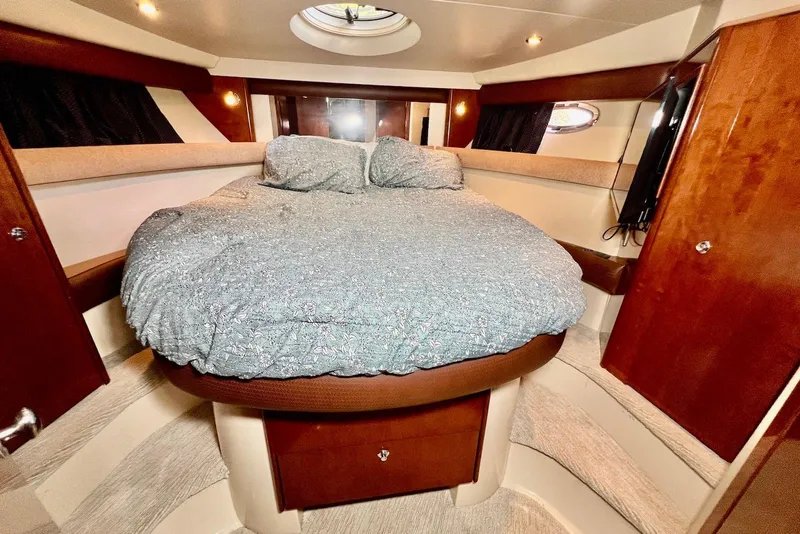 Slide: The Image of Luxurious 2008 Meridian 391 Sedan bedroom with cozy bedding and elegant wood finishes. - 24