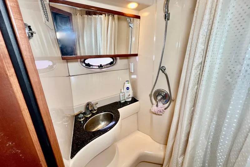 Slide: The Image of 2008 Meridian 391 Sedan bathroom with sink, mirror, and shower area. - 26