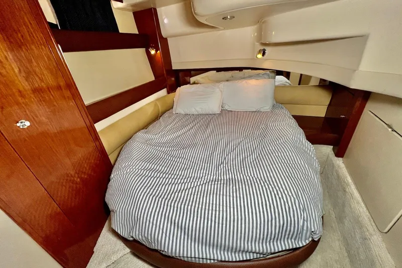 Slide: The Image of Luxurious cabin interior of 2008 Meridian 391 Sedan with cozy bed and elegant wood finishes. - 27
