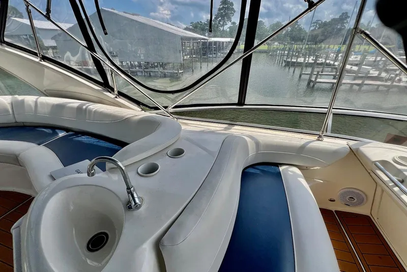 Slide: The Image of Luxurious interior of 2008 Meridian 391 Sedan yacht with sink and seating, overlooking marina. - 5