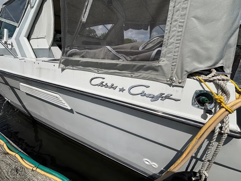 Slide: The Image of 1987 Chris-Craft 336 Amerosport boat docked, featuring classic design and branding. - 5