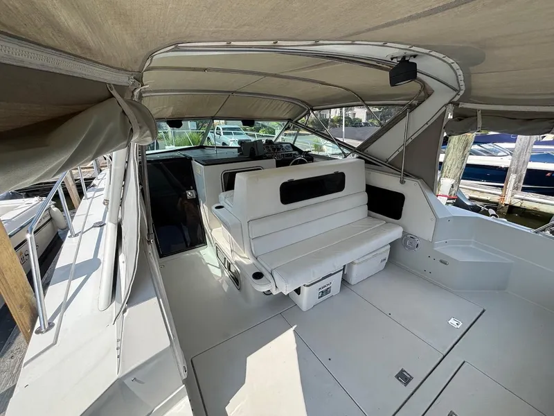 Slide: The Image of 1987 Chris-Craft 336 Amerosport boat interior with seating and canopy. - 9