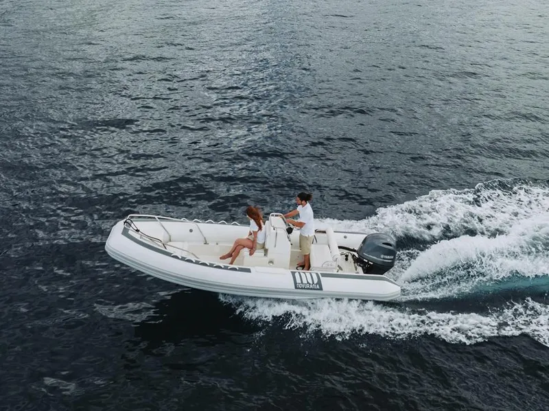 Slide: The Image of Novurania DL 550 boat cruising on open water, 2026 model. - 11