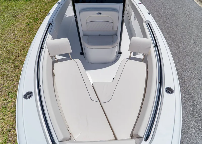 Slide: The Image of 2026 Sea Hunt Ultra 245 SE boat interior with cushioned seating and sleek design. - 24