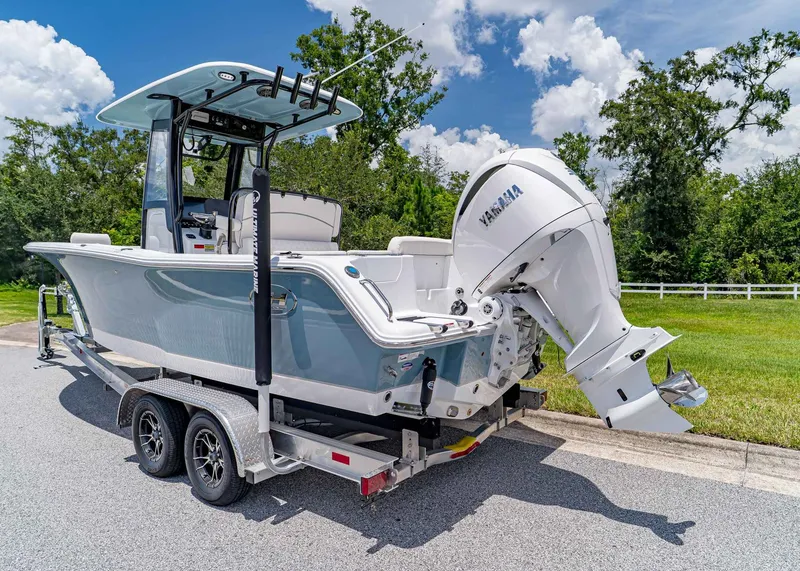 Slide: The Image of 2026 Sea Hunt Ultra 245 SE boat on trailer, featuring Yamaha outboard motor. - 4