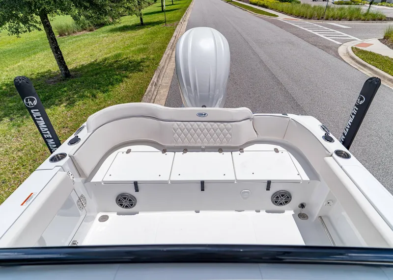 Slide: The Image of 2026 Sea Hunt Ultra 245 SE boat interior with cushioned seating and storage compartments. - 6