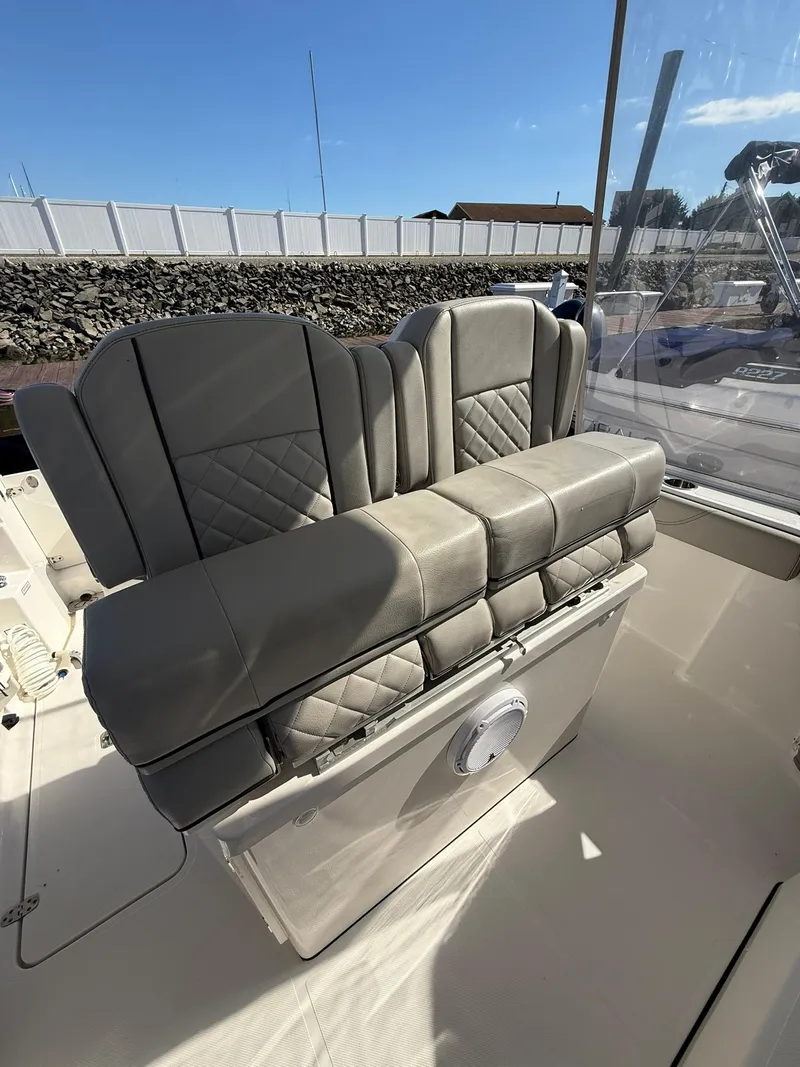 Slide: The Image of 2023 Pursuit S 268 Sport boat with luxurious gray seating and sleek design. - 18