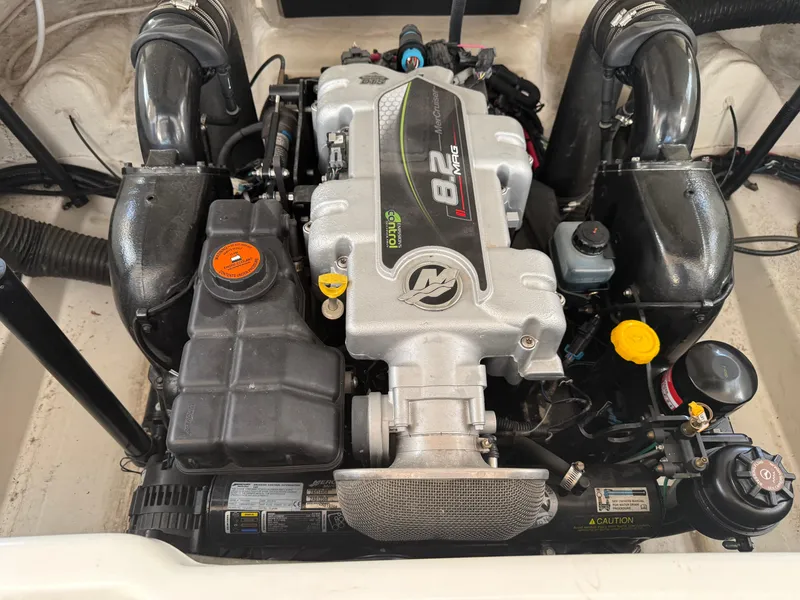 Slide: The Image of 2012 Sea Ray 270 SLX boat engine, featuring an 8.2 MAG MerCruiser motor. - 11