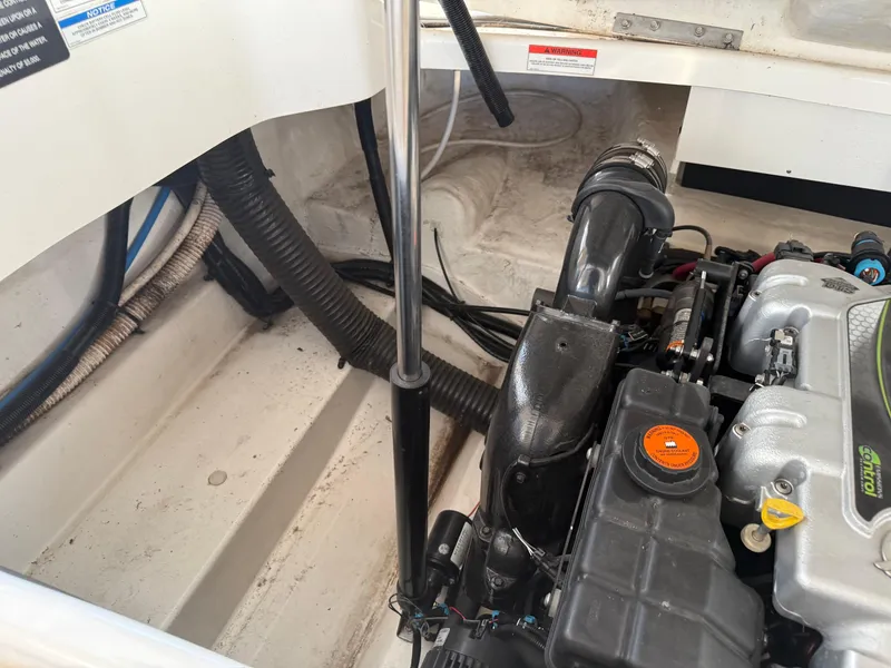 Slide: The Image of Engine compartment of a 2012 Sea Ray 270 SLX boat, showing detailed components. - 13