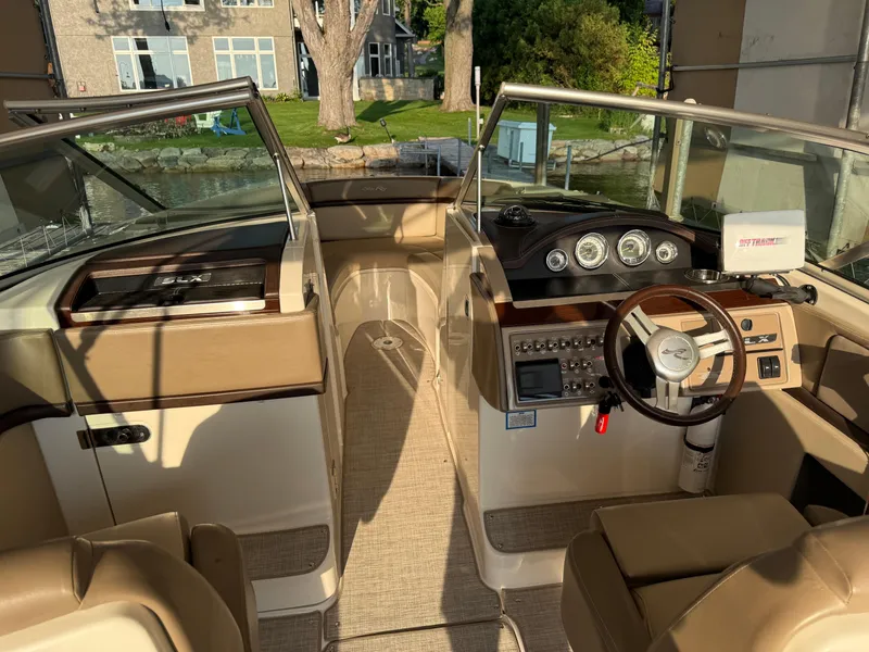 Slide: The Image of Interior view of 2012 Sea Ray 270 SLX boat with steering wheel and dashboard. - 21