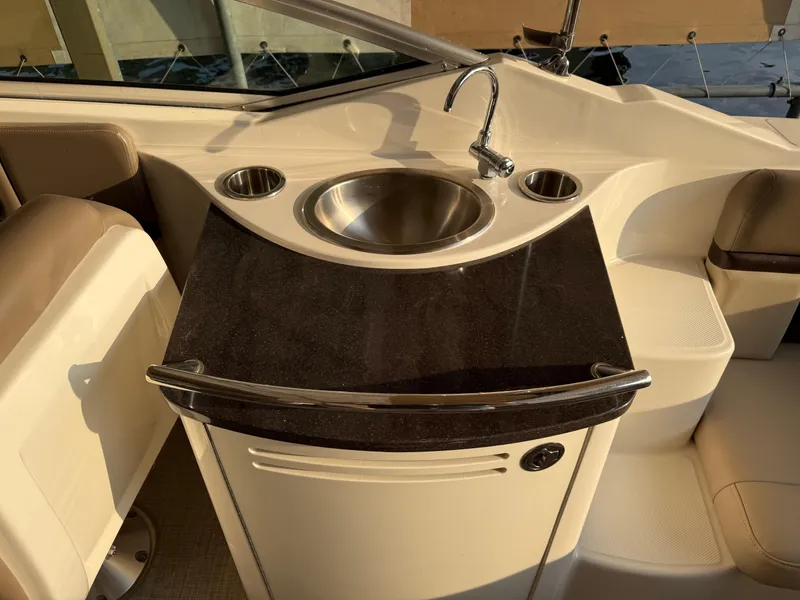 Slide: The Image of 2012 Sea Ray 270 SLX boat interior with sink and countertop. - 22
