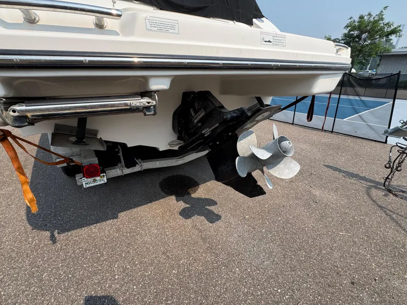 Slide: The Image of Rear view of a 2012 Sea Ray 270 SLX boat with visible propeller and trailer. - 26