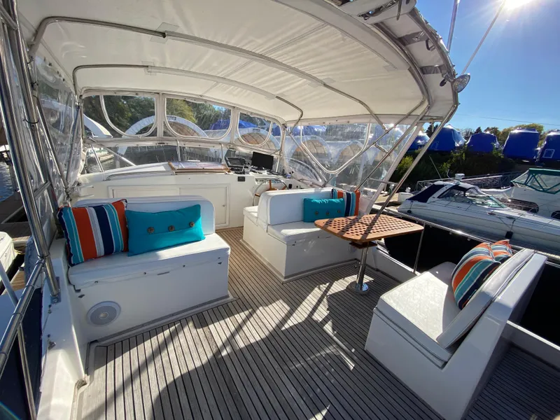 Slide: The Image of 1992 Grand Banks 46 Europa yacht interior with seating and colorful cushions. - 12