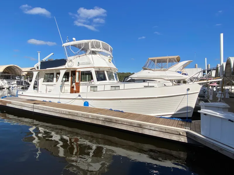 Slide: The Image of Grand Banks 46 Europa 1992 yacht docked at marina under clear blue sky. - 2