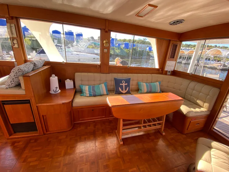 Slide: The Image of Interior of 1992 Grand Banks 46 Europa yacht with cozy seating and nautical decor. - 22