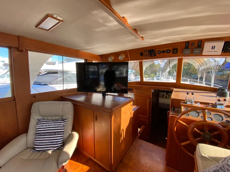 Slide: The Image of Interior of 1992 Grand Banks 46 Europa yacht with helm, TV, and seating area. - 25