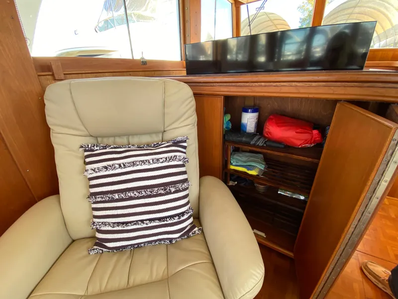Slide: The Image of Leather chair with striped pillow in 1992 Grand Banks 46 Europa yacht interior. - 26