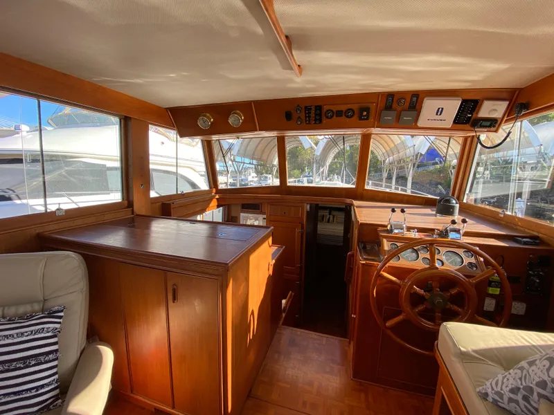 Slide: The Image of Interior of 1992 Grand Banks 46 Europa yacht with wooden helm and seating area. - 27