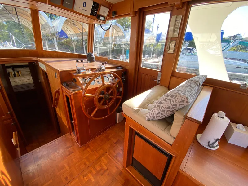 Slide: The Image of Interior of 1992 Grand Banks 46 Europa yacht with wooden helm and seating area. - 28