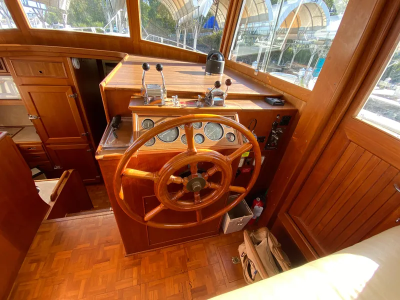 Slide: The Image of Helm of 1992 Grand Banks 46 Europa yacht with wooden steering wheel and controls. - 29