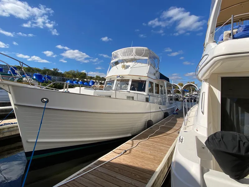 Slide: The Image of Grand Banks 46 Europa 1992 yacht docked under a clear blue sky. - 3