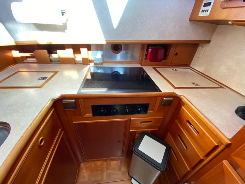 Slide: The Image of Kitchen area of a 1992 Grand Banks 46 Europa yacht with modern appliances. - 35
