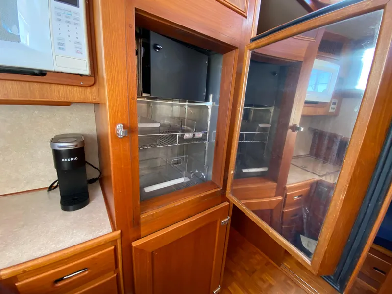 Slide: The Image of Interior of 1992 Grand Banks 46 Europa yacht with wooden cabinetry and modern appliances. - 36