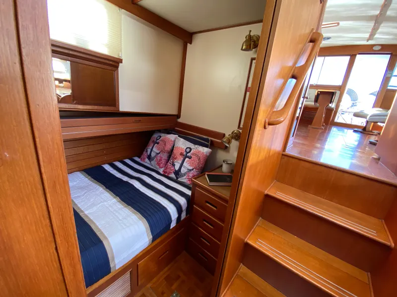 Slide: The Image of Cozy cabin interior of 1992 Grand Banks 46 Europa yacht with nautical-themed bedding. - 38