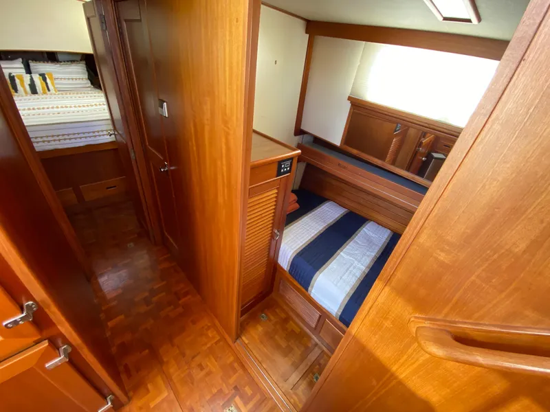 Slide: The Image of Cabin interior of 1992 Grand Banks 46 Europa yacht with wooden finish and cozy bedding. - 39