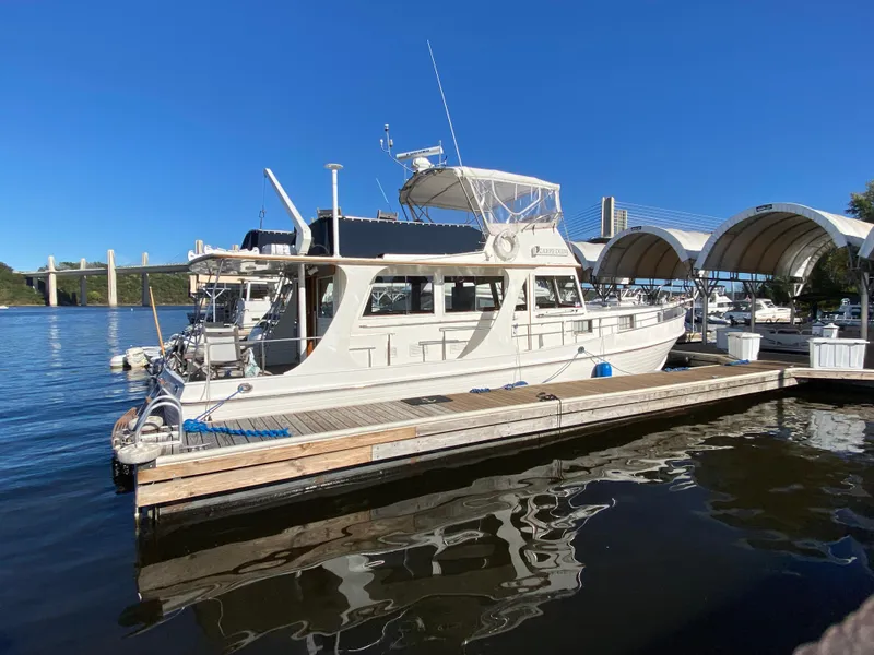 Slide: The Image of Grand Banks 46 Europa 1992 yacht docked at marina under clear blue sky. - 4