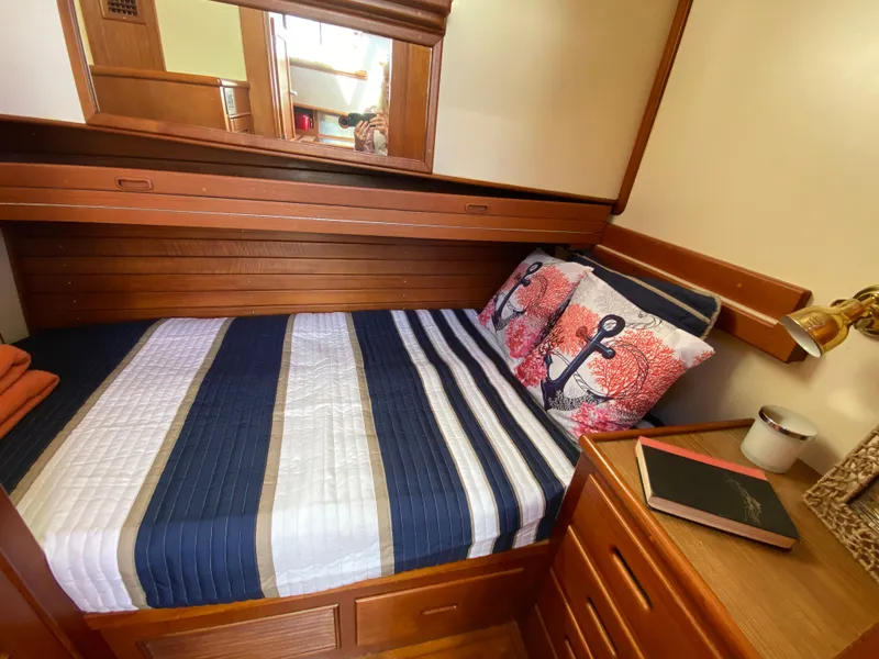 Slide: The Image of Cozy cabin interior of 1992 Grand Banks 46 Europa with nautical-themed bedding. - 40