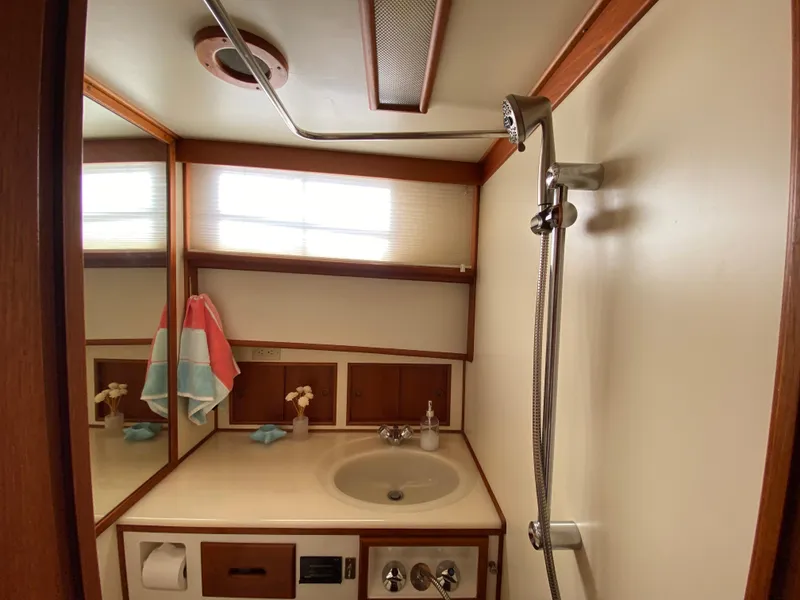 Slide: The Image of Bathroom interior of 1992 Grand Banks 46 Europa yacht, featuring sink and shower. - 48