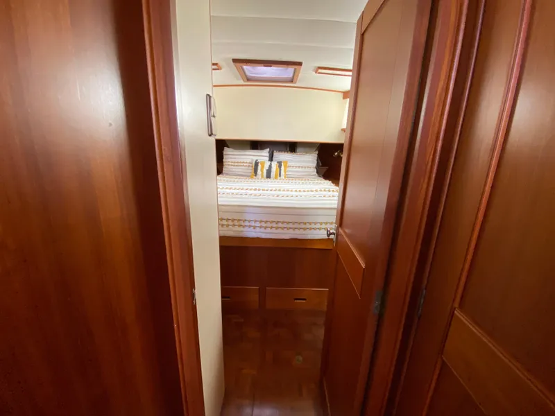 Slide: The Image of Cozy cabin interior of 1992 Grand Banks 46 Europa yacht with wooden finish. - 49