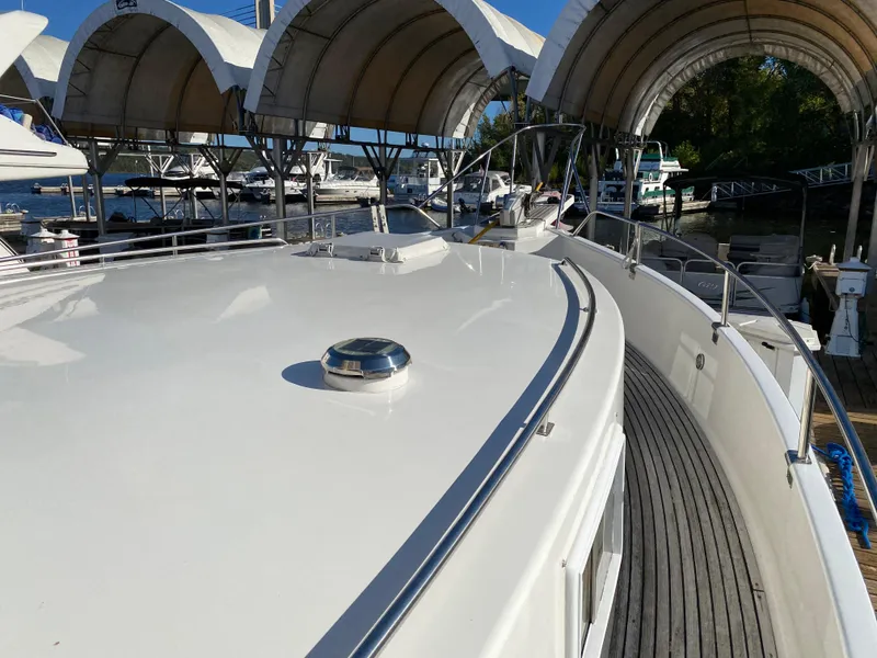 Slide: The Image of Grand Banks 46 Europa 1992 yacht deck with marina backdrop. - 5