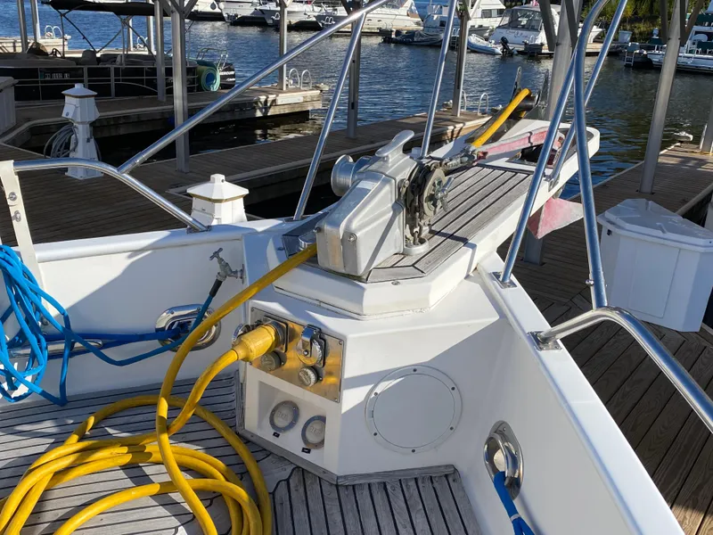 Slide: The Image of Bow of 1992 Grand Banks 46 Europa yacht with docked marina view. - 7