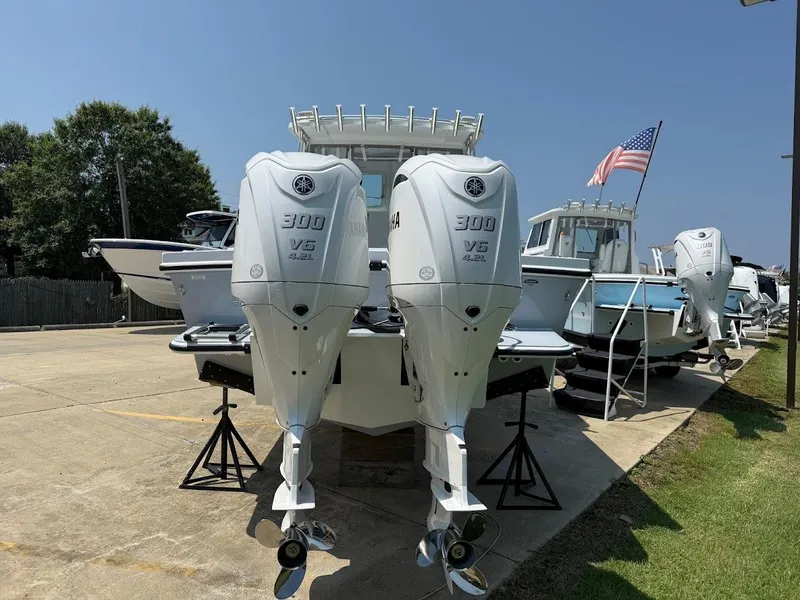 Slide: The Image of 2026 Steiger Craft 28 Fisherman with dual Yamaha 300 V6 engines on display. - 2