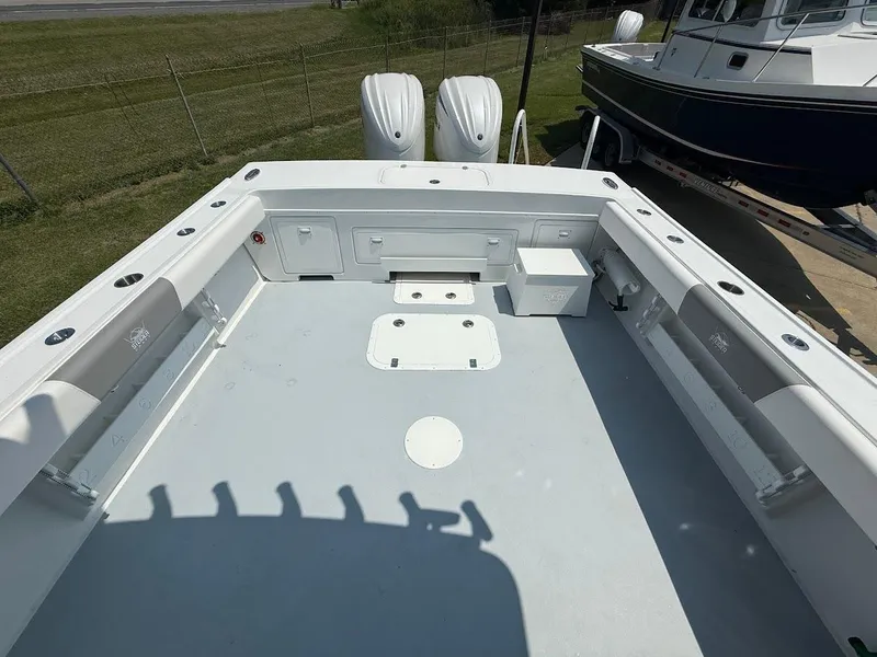 Slide: The Image of 2026 Steiger Craft 28 Fisherman boat deck with dual engines and spacious layout. - 7