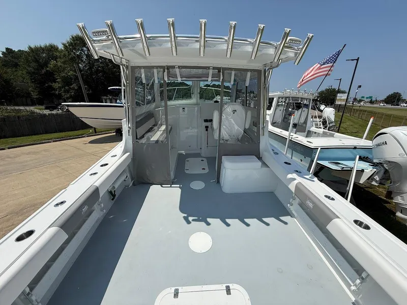 Slide: The Image of 2026 Steiger Craft 28 Fisherman boat with spacious deck and American flag. - 8