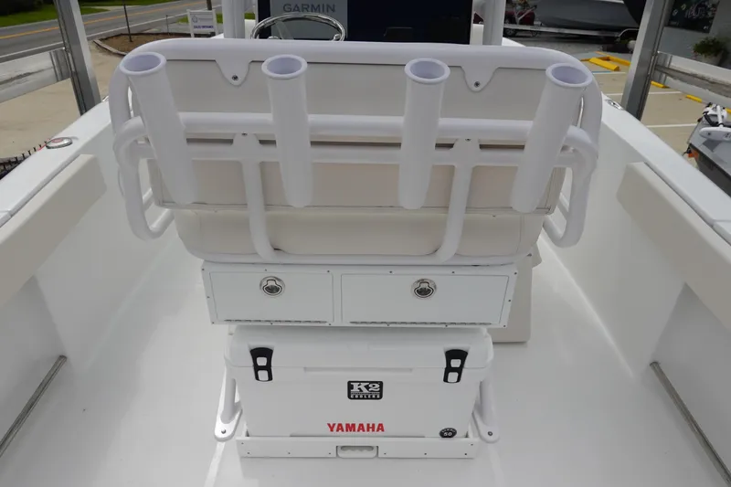 Slide: The Image of 2026 Sea Hunt Ultra 229 boat interior with rod holders and Yamaha cooler. - 13