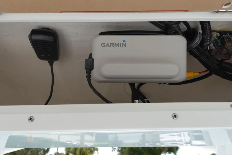 Slide: The Image of Garmin device installed in 2026 Sea Hunt Ultra 229 boat compartment. - 21