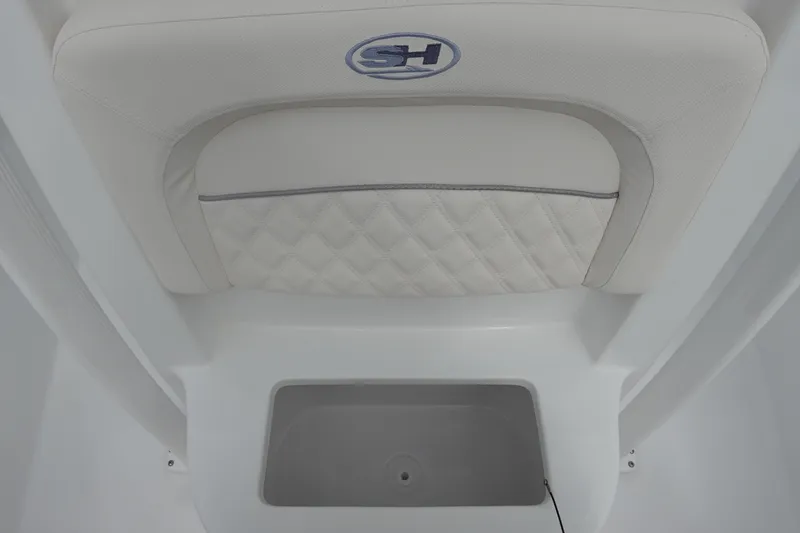 Slide: The Image of 2026 Sea Hunt Ultra 229 boat seat with storage compartment, featuring quilted upholstery. - 23