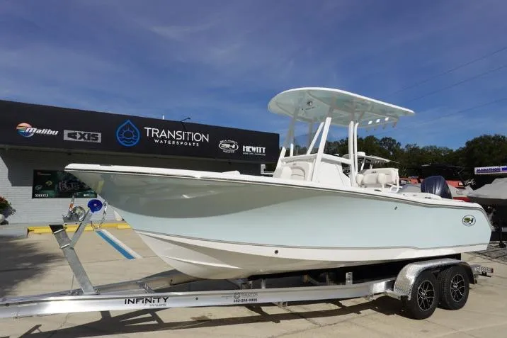 Slide: The Image of 2026 Sea Hunt Ultra 229 boat on trailer at Transition Watersports dealership. - 3