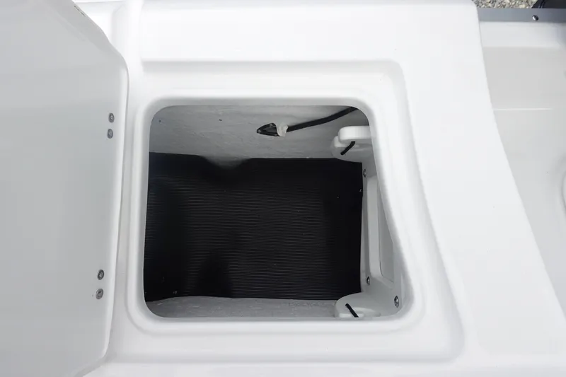 Slide: The Image of Storage compartment of 2026 Sea Hunt Ultra 229 boat, open and empty. - 32