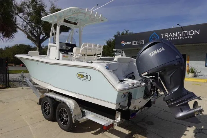 Slide: The Image of 2026 Sea Hunt Ultra 229 boat with Yamaha engine on trailer at dealership. - 6