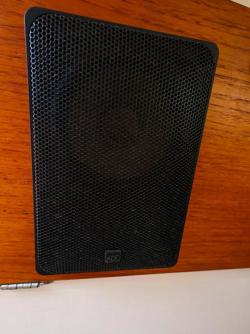Slide: The Image of Black speaker mounted on wooden panel inside 1987 Sabre 36 Sloop sailboat. - 32