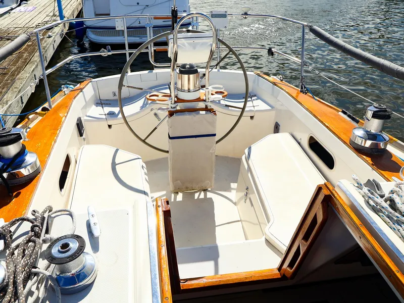 Slide: The Image of Cockpit of 1987 Sabre 36 Sloop sailboat with steering wheel and winches. - 5